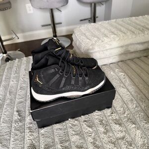Jordan Women's Sneakers in Black with Gold Highlights